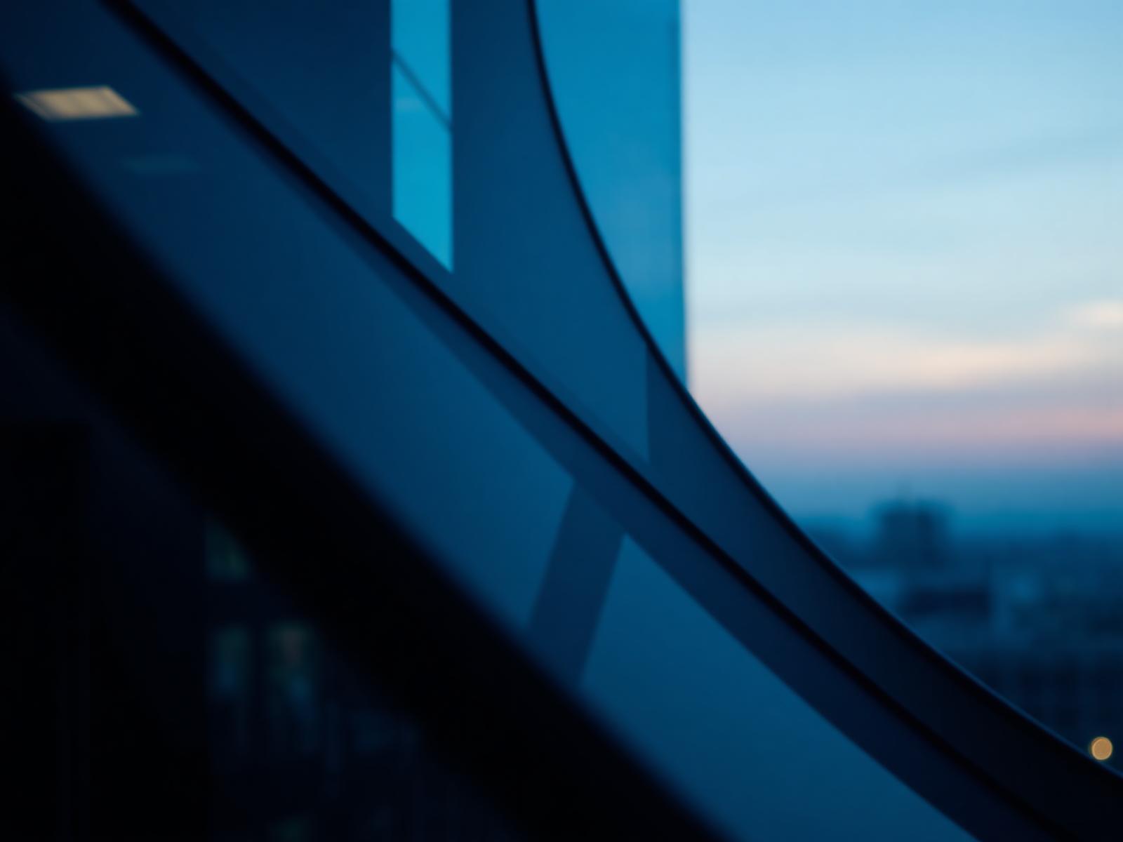 Architectural view from a modern executive boardroom at dusk